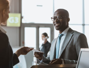 A businessman receiving assistance at a bank.