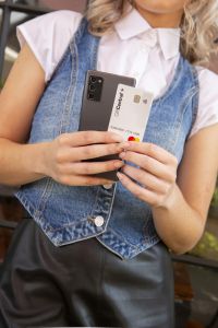 Employee holding GiftCentral+ corporate gift card